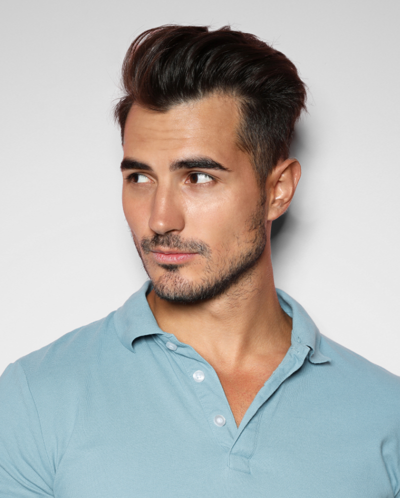 Portrait shot of a man wearing a blue polo shirt